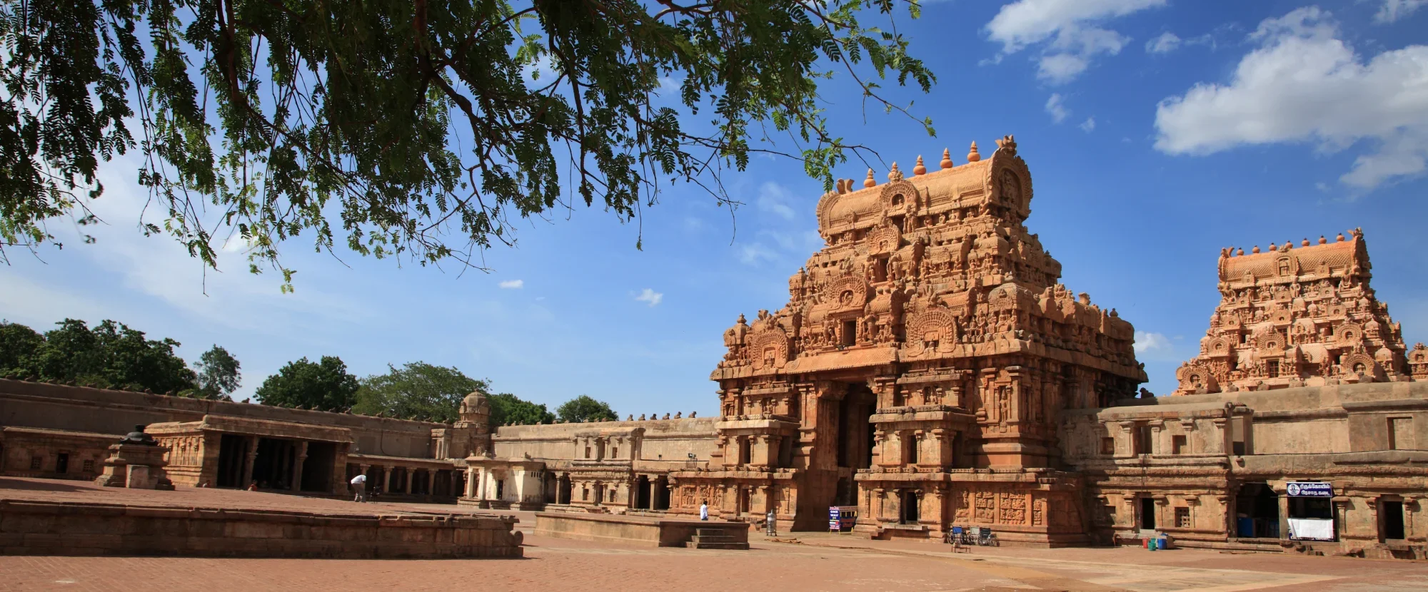Intricately carved temples surrounding courtyard in Tanjore